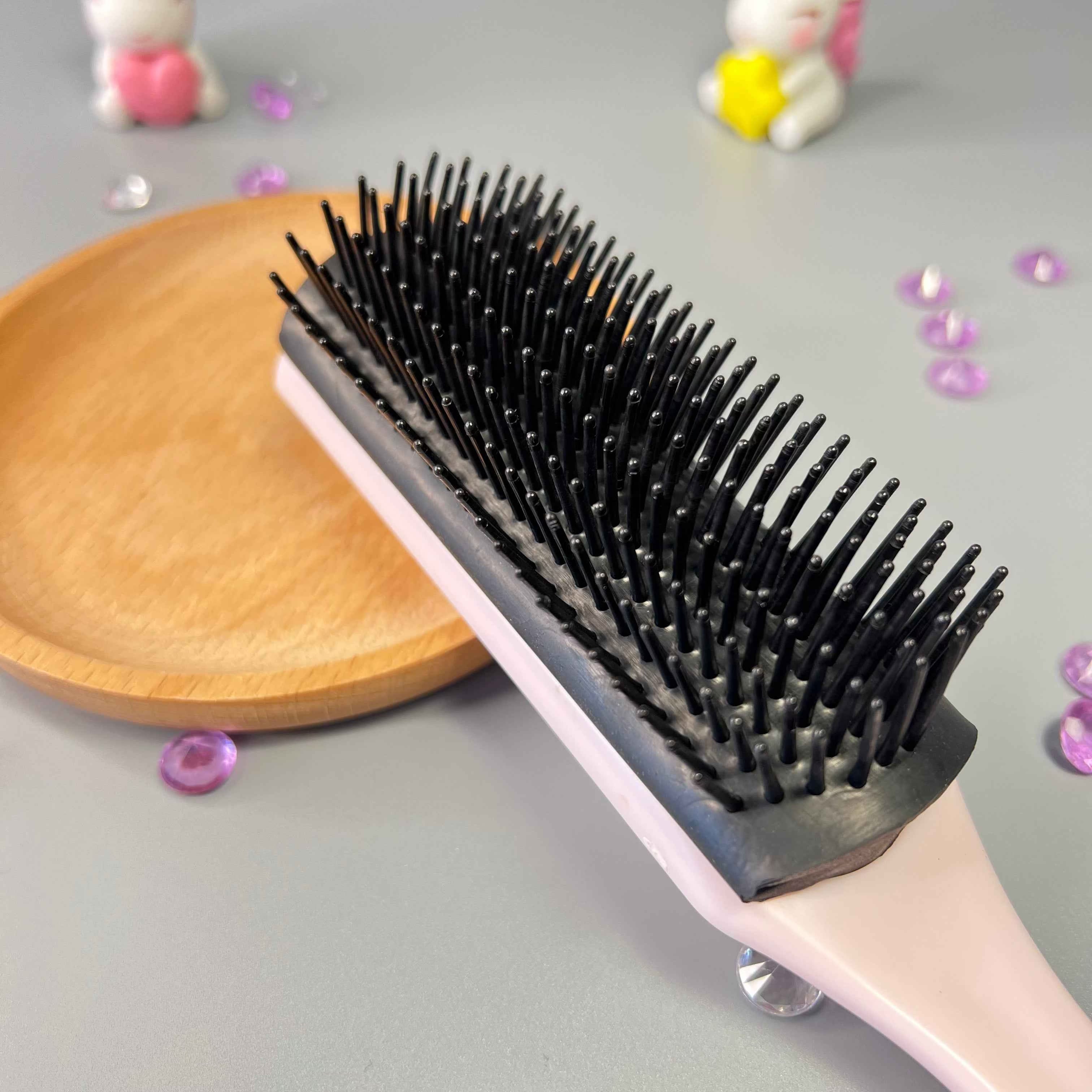 Rangées ajustables de la brosse démêlante Frisette