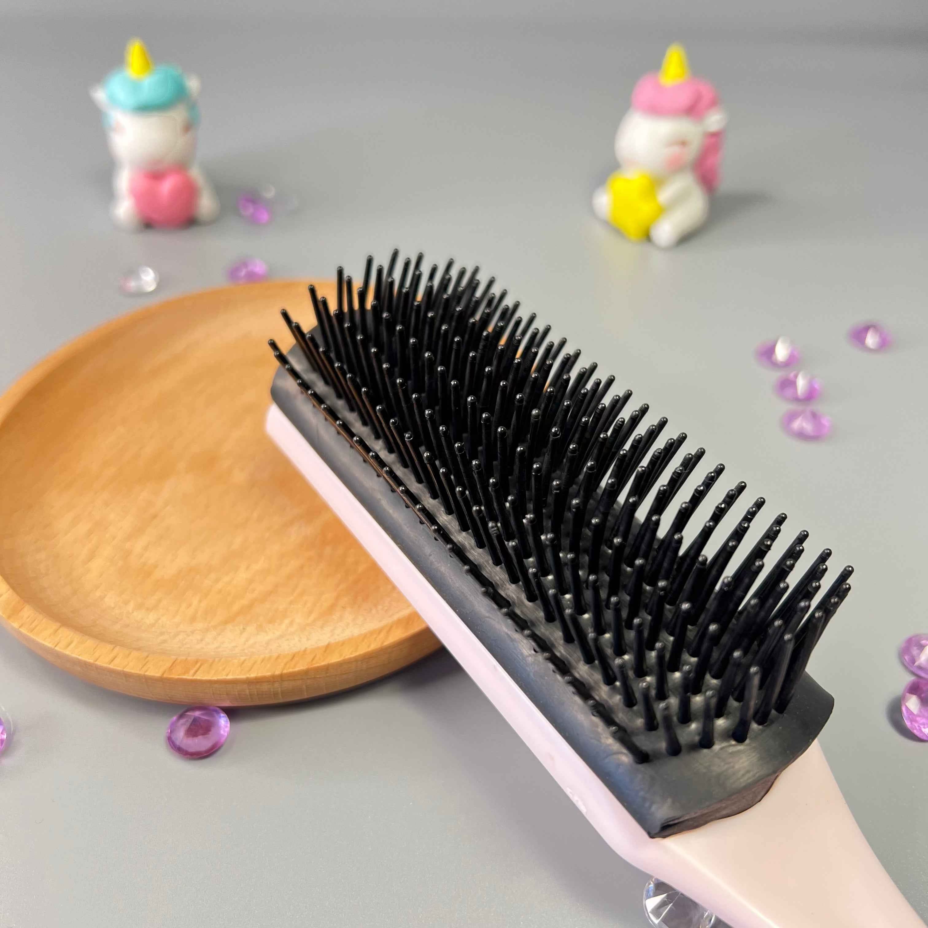 Brosse Frisette pour démêler les cheveux frisés d’un enfant