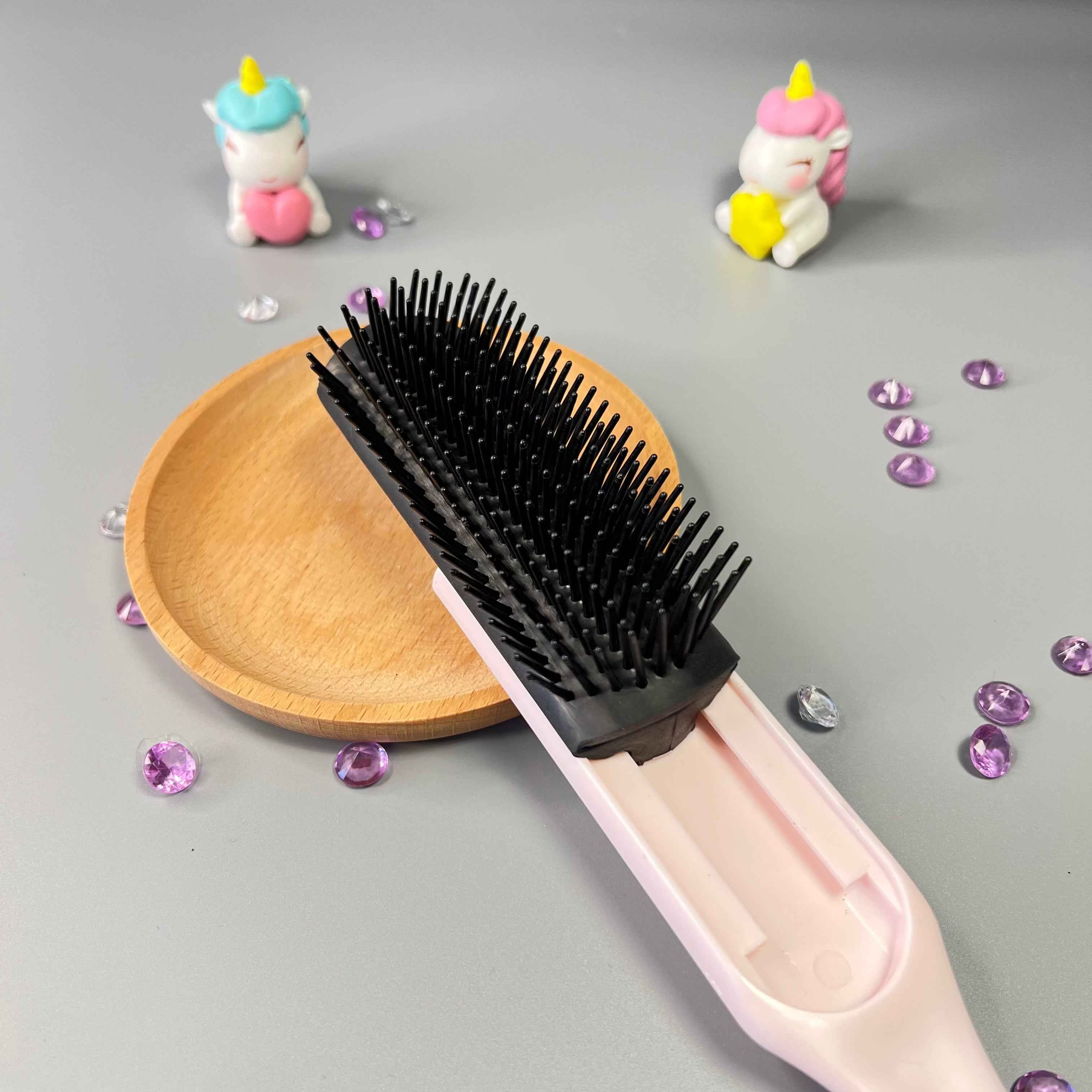 Rangées ajustables de la brosse démêlante Frisette