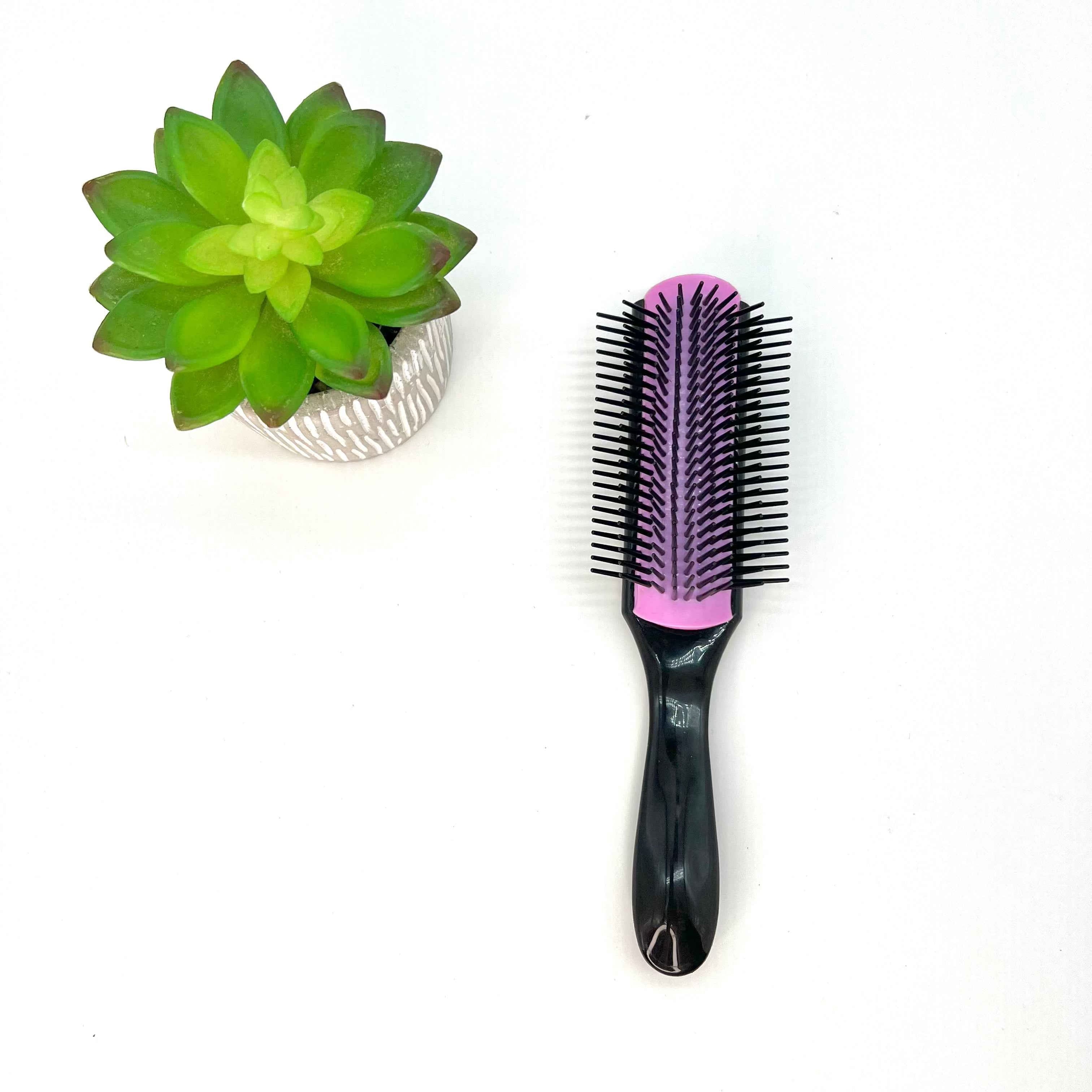 Rangées ajustables de la brosse démêlante Frisette