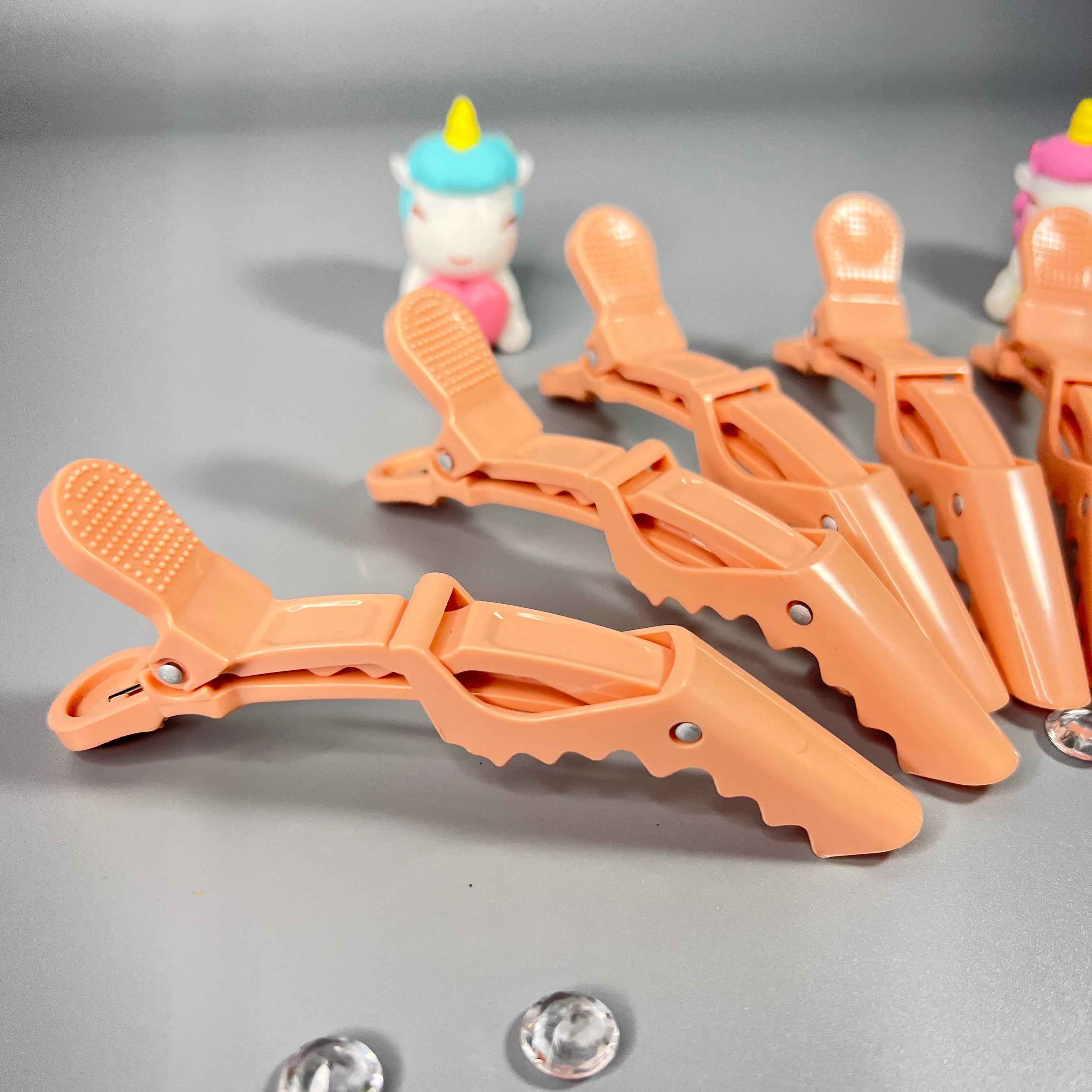 Accessoire pour séparer les cheveux bouclés et crépus
